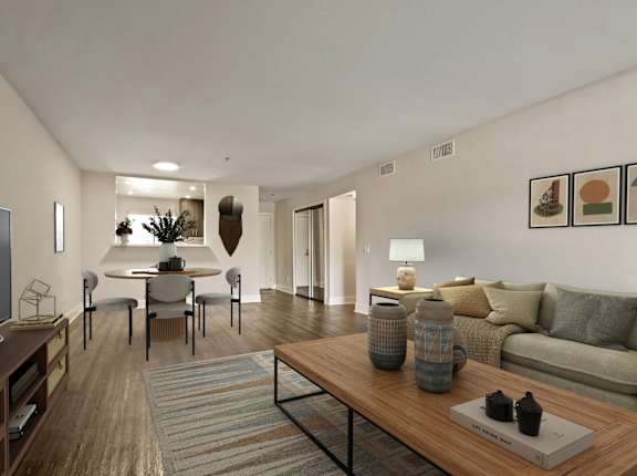 A modern living room with a wooden coffee table and a grey sofa.