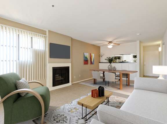 A living room with a green chair and a white couch.