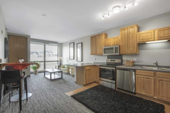 a kitchen and living room in a 555 waverly unit