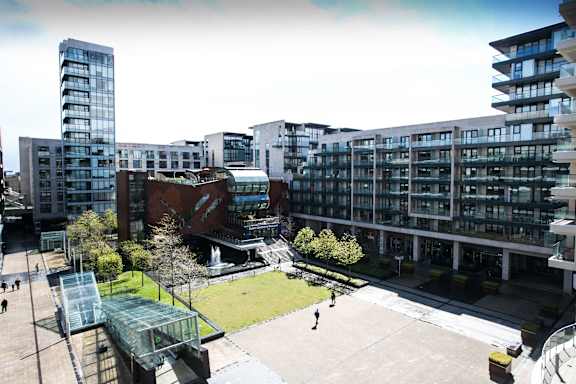 a view of a park and buildings in a city