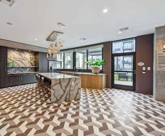 the lobby of a hotel with a marble bar and a checkered floor at Link Apartments® Broad Ave, Memphis, Tennessee
