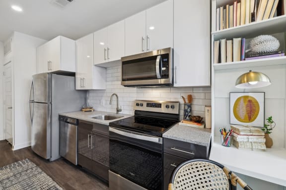 a kitchen and living room in a 555 waverly unit at Link Apartments® Broad Ave, Memphis