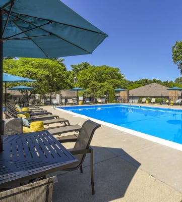 Outdoor Pool With Umbrella Shade at Silvertree at Little Turtle in Westerville, Ohio