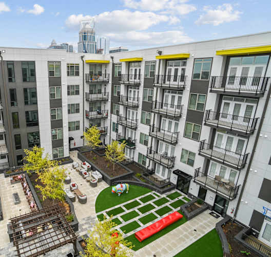 an aerial view of an apartment complex with a green courtyard  at Link Apartments® Mint Street, Charlotte, North Carolina