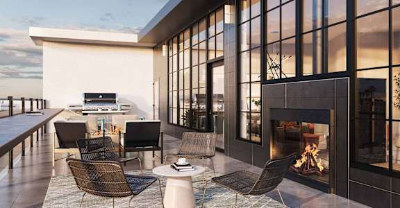 a rendering of a patio with chairs and a fireplace
