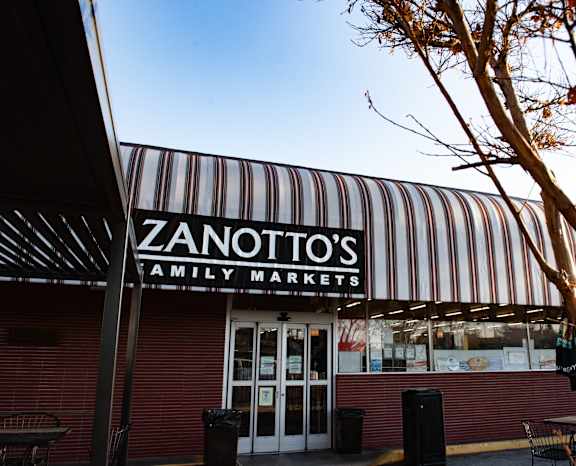 A striped awning hangs over the entrance to Zanotto's Family Markets.