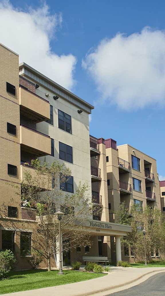Apartment buildings with a street in front.