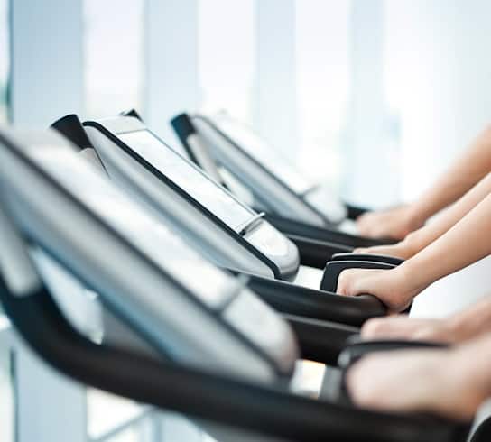 two people on a cardio machine at the gym at Apartments at Denver Place,Denver, CO 80202