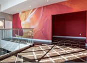 Thumbnail 6 of 11 - Lobby with patterned tile and colorful walls and modern cube chandeliers