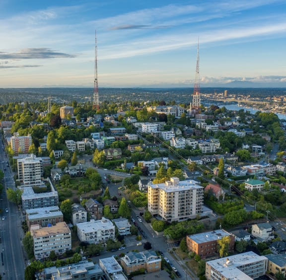 an aerial view of the city with two radio towers