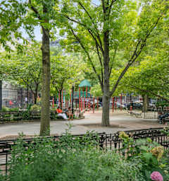 A park with trees and benches.
