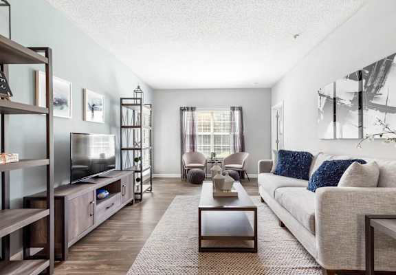 a living room with a couch and a tv