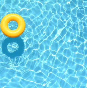 yellow rubber ring floating in a swimming pool