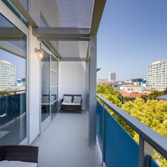 a balcony with a view of the city