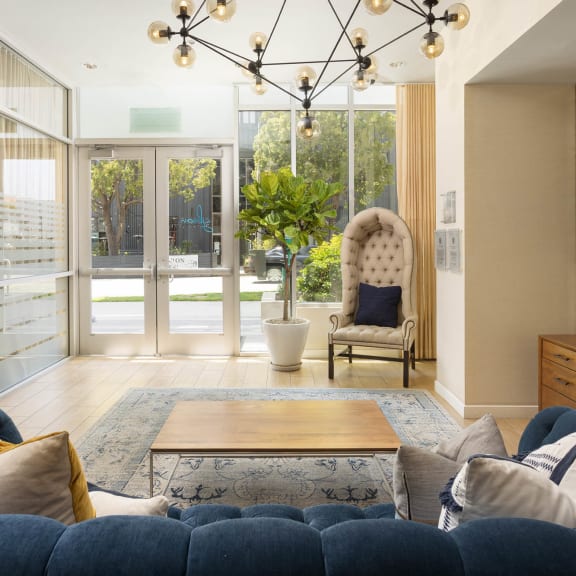a living room filled with furniture and a large window