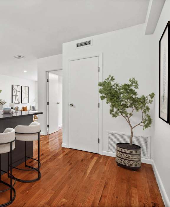A modern kitchen with a white refrigerator, stove, and oven.