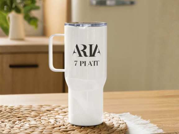 A white mug with the word Aria and the number 7 on it.
