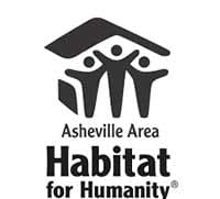 a sign for ahabitat for humanity with three people standing in front of it