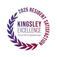 A circular logo with the words "Kingsley Excellence" surrounded by a laurel wreath.