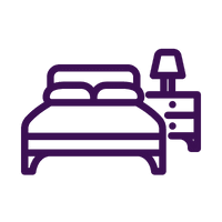 a bed with a purple bedspread and a black background