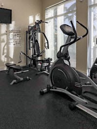fitness center with cardio and strength training equipment