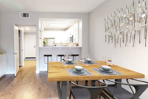 a dining room with a wooden table and a kitchen in the background  at Mission Hills, Camarillo, California