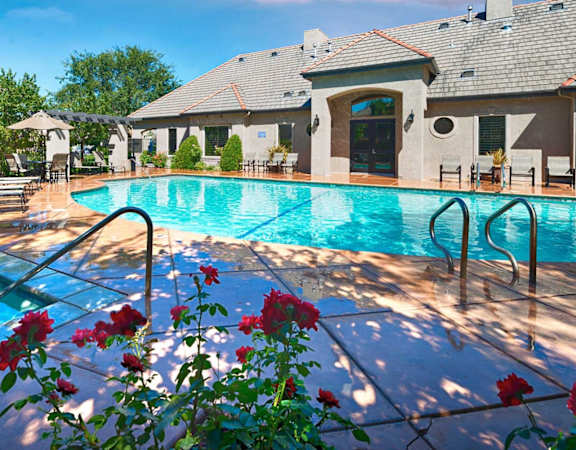 Glimmering pool surrounded by roses, Le Provence at the Dominion, 93720