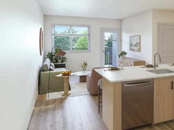 A kitchen with a large island and wooden floors.