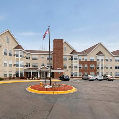 A large building with a flag on top of a pole.