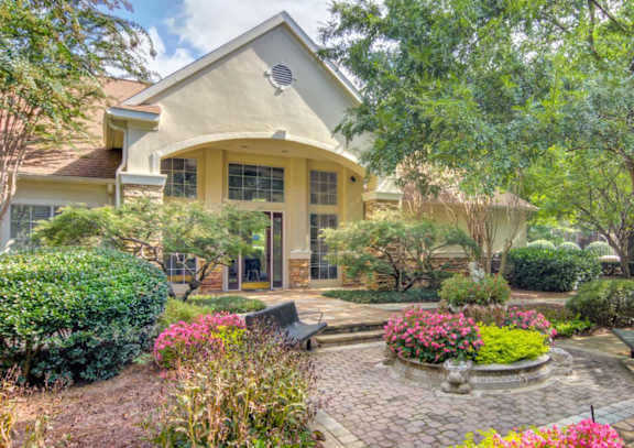 A house with a garden in front.