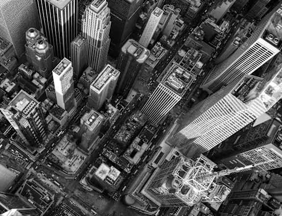 A black and white aerial view of a bustling cityscape.at London Terrace Gardens, New York, 10011