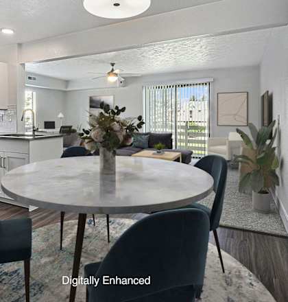 A modern kitchen with a dining table set for four at Green Ridge Apartments, Grand Rapids, MI