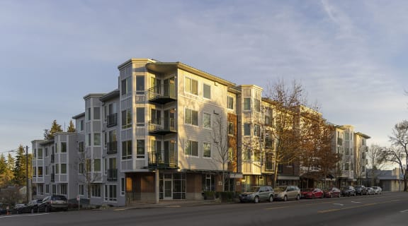 a rendering of a large apartment building on a city street