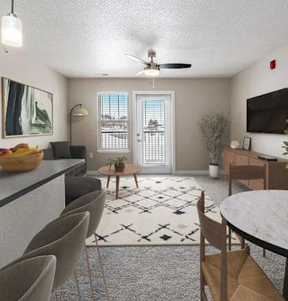 A modern dining room with a large table and chairs at Eagle Ridge Apartment Homes in Traverse City, MI