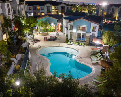 an aerial view of a swimming pool at night