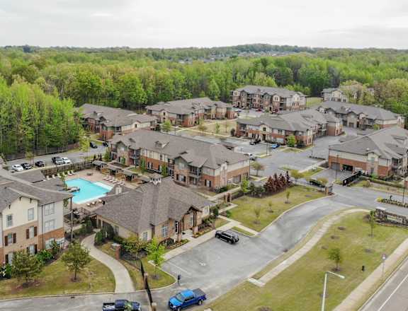 an aerial view of a neighborhood of apartment buildings and a swimming pool at Hall Creek, Arlington, Tennessee