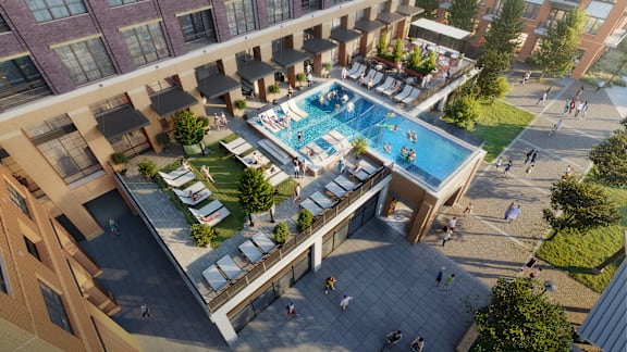 an aerial view of an apartment building with a swimming pool