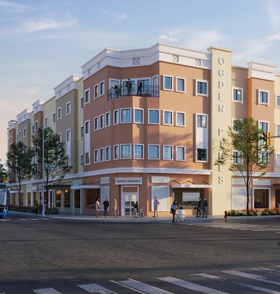 A street view of a building with the words "OGDEN" on the side.