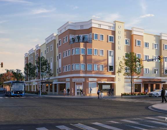 A street view of a building with the words "OGDEN" on the side.