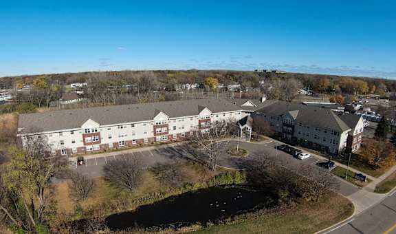 an aerial view of several buildings in a parking lot