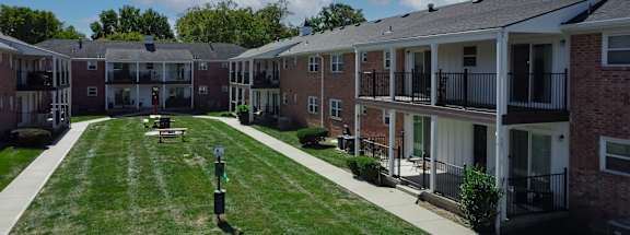 A sunny day at the apartment complex with a clear blue sky.