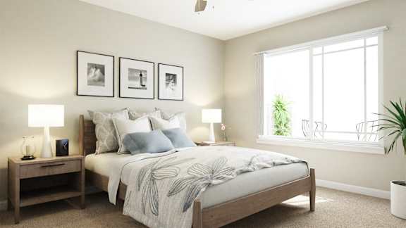 A bedroom with a bed, two nightstands, and a window.