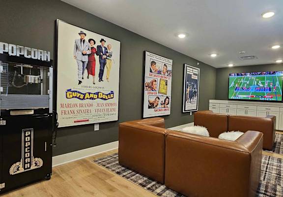 a living room with leather couches and a tv