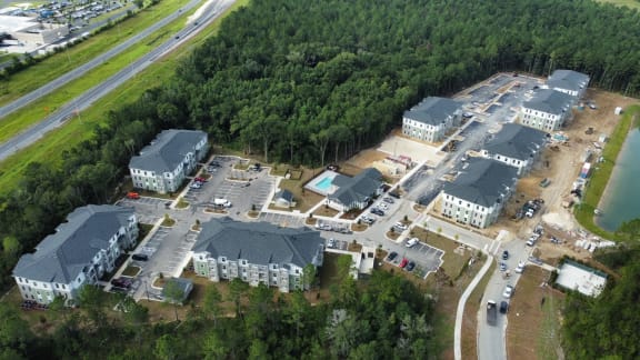 a group of buildings in a wooded area