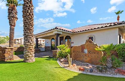 a house with a sign that says stone ridge apartments