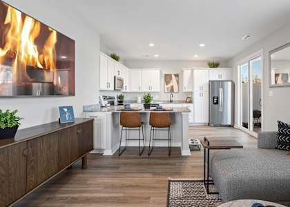 a modern rental home living room and kitchen at newly constructed Sanctuary at Indian Creek near Redstone Arsenal