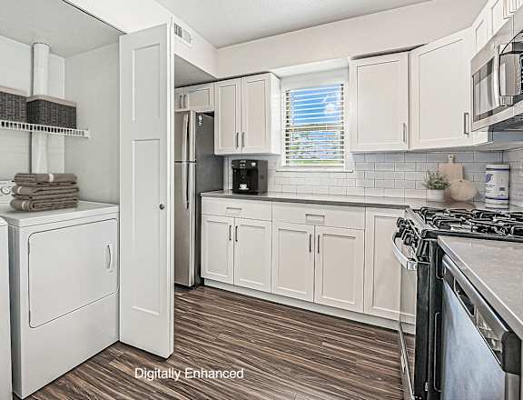 Modern Kitchen Equipped with Appliances and Washer & Dryer Set at Green Ridge Apartments, Grand Rapids, MI