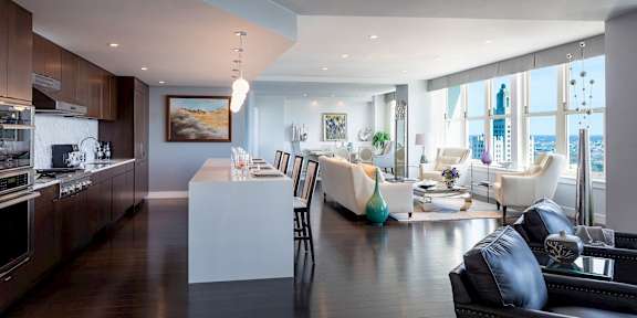 A modern kitchen with dark wood floors at Residences Providence, Providence, RI 2903