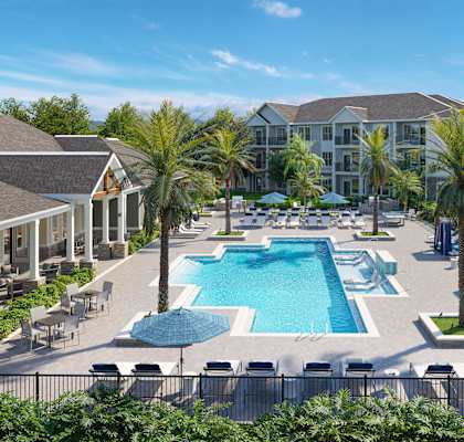 an aerial view of an outdoor pool with chairs and umbrellas at the resort