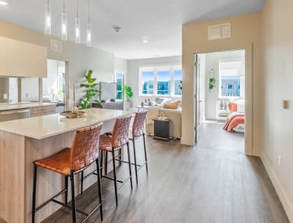 a kitchen with an island and bar stools